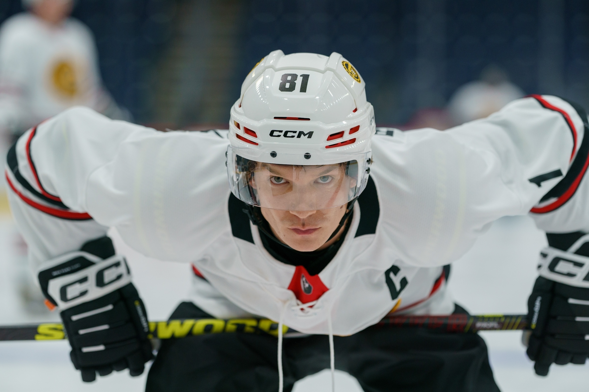 Connor Storrie as Ilya Rozanov in a hockey uniform.