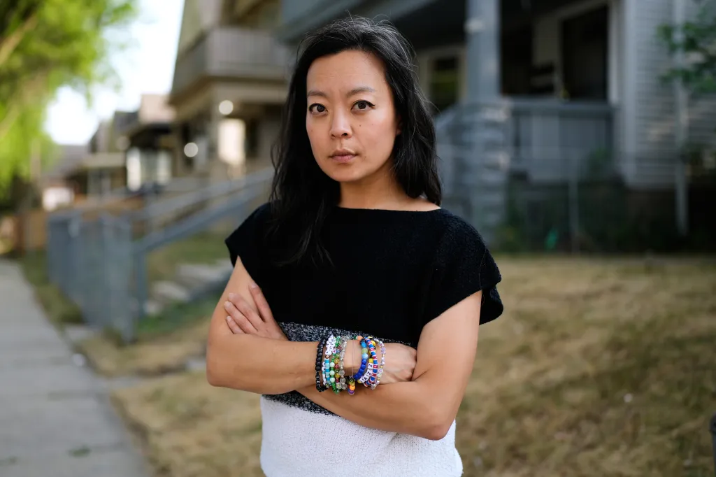 Democratic gubernatorial candidate Francesca Hong poses for a photo with arms crossed.