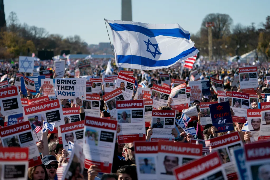 Pro-Israel demonstrators on the National Mall hold signs denouncing antisemitism and calling for the release of Israeli hostages.