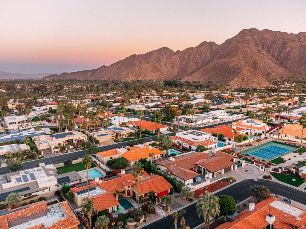 Elevated view of homes in Palm Desert, California, with the Santa Rosa Mountains in the background.