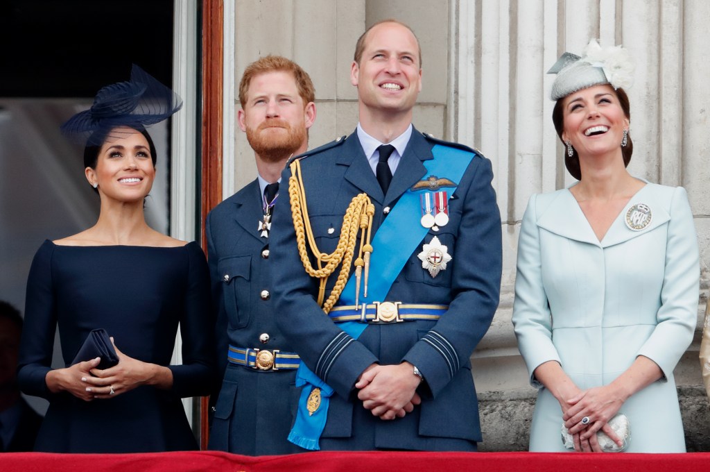 Meghan, Duchess of Sussex, Prince Harry, Prince William, and Catherine, Duchess of Cambridge, watch a flypast.