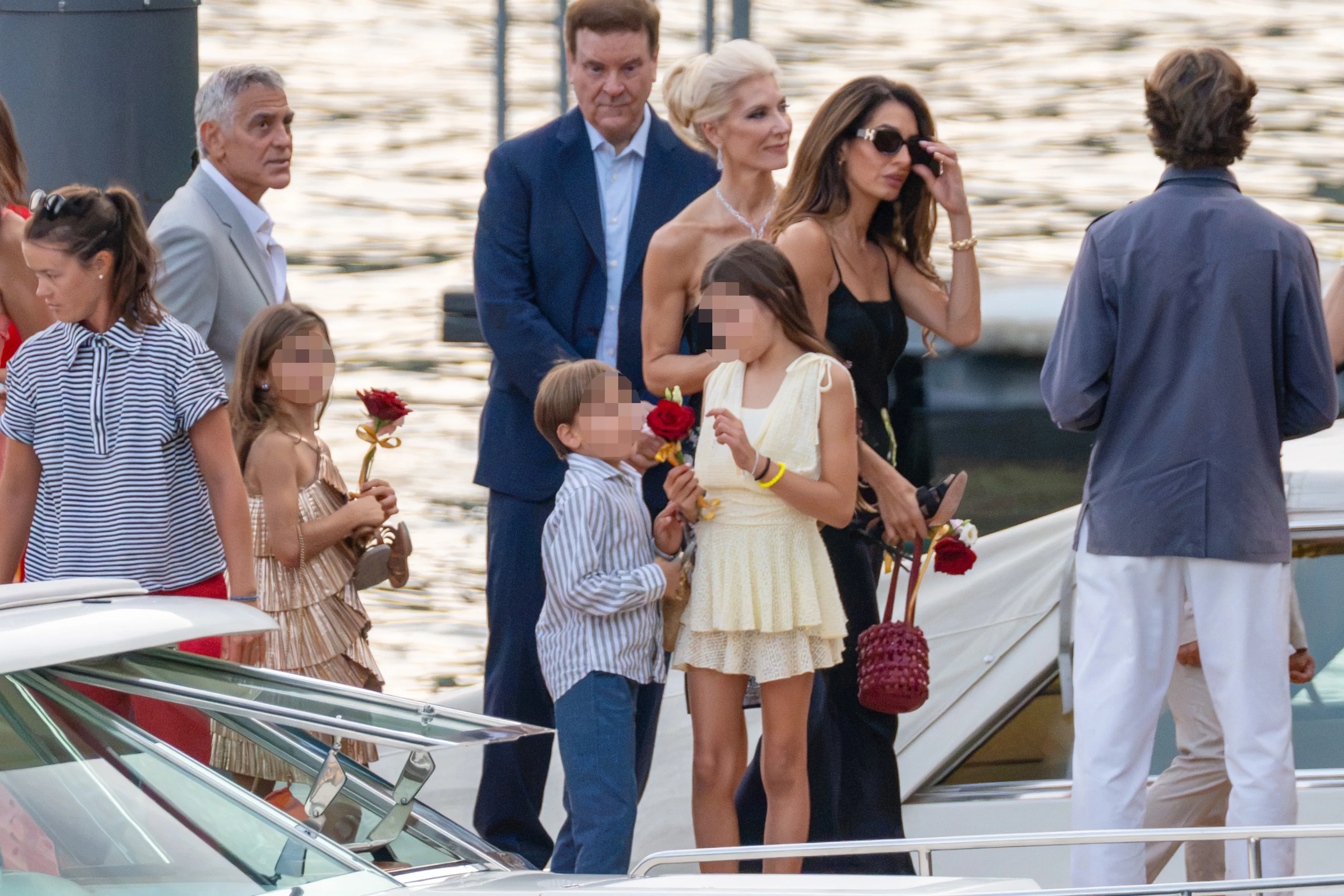George and Amal Clooney with Ella and Alexander Clooney at a charity event in Villa Passalacqua.