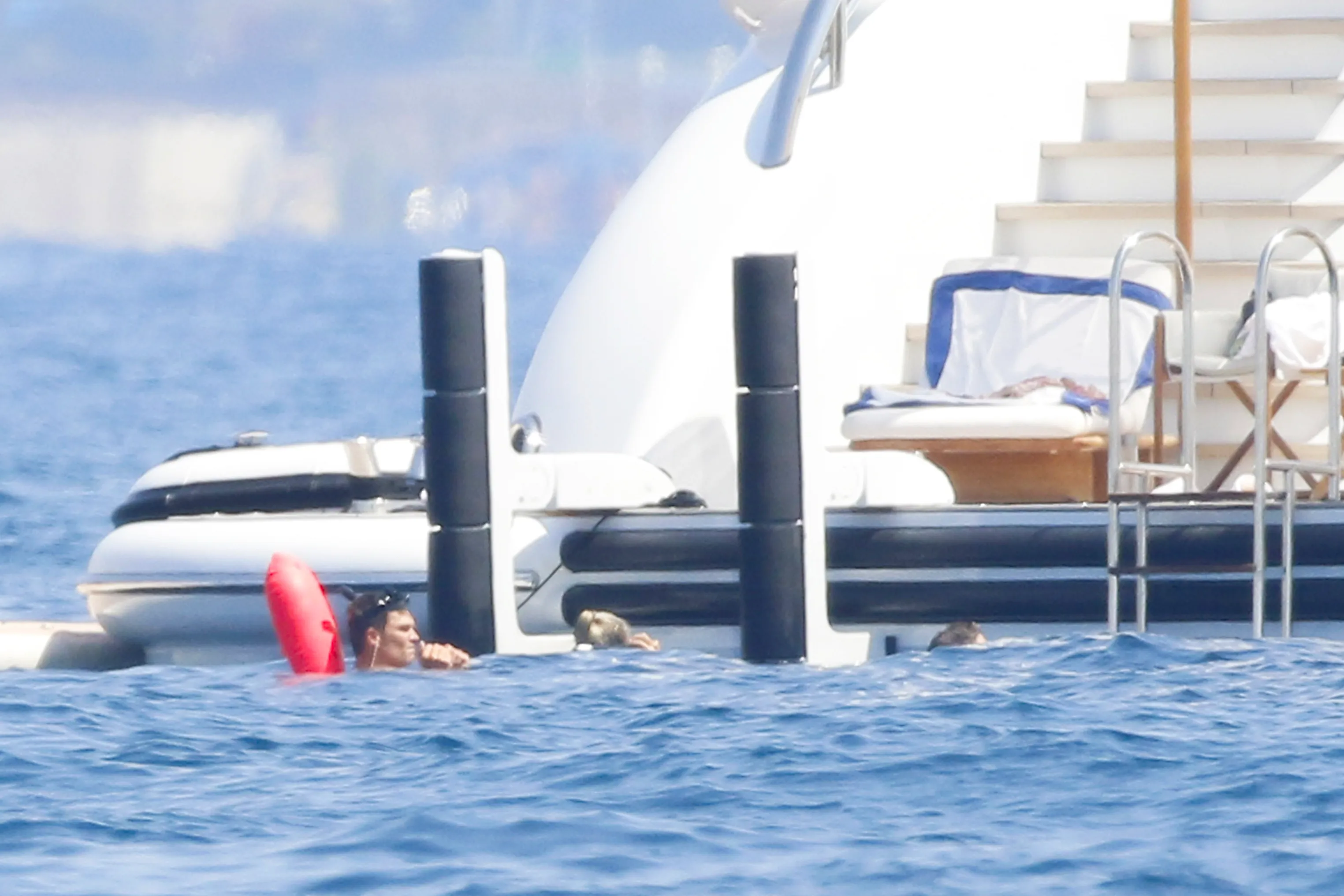 Tom Brady snorkeling with a blonde woman in the South of France.