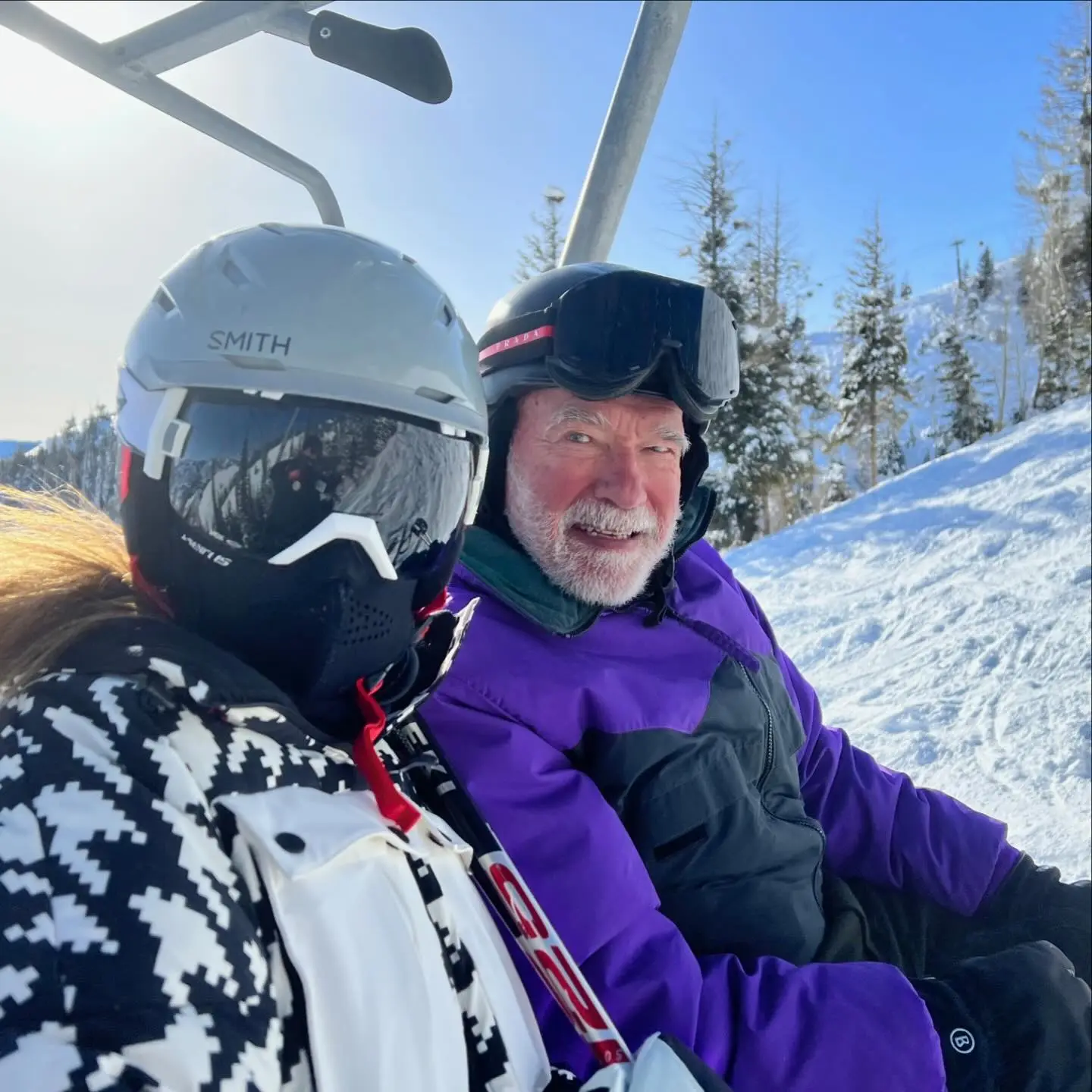 Arnold Schwarzenegger and Maria Shriver on a ski lift.
