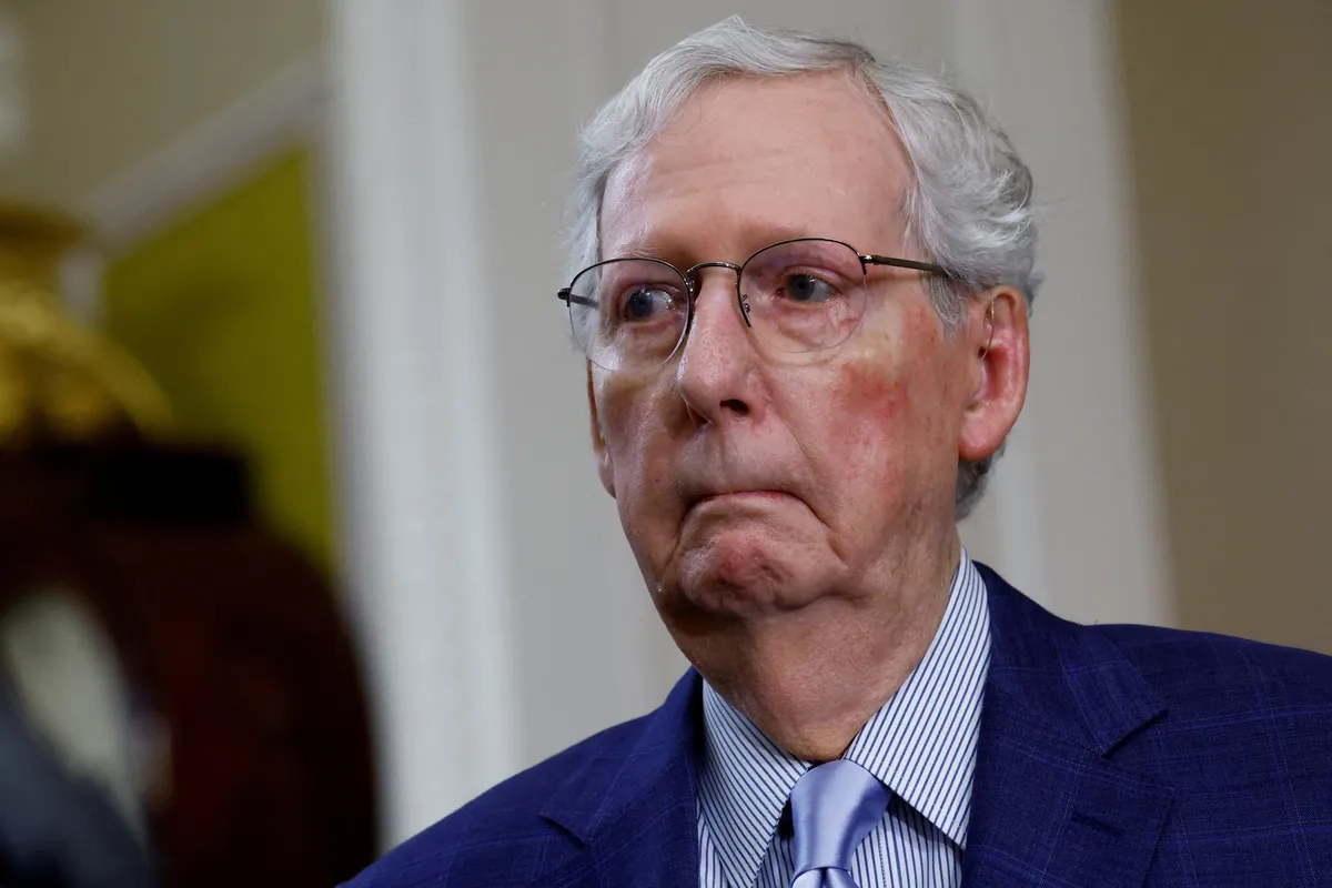 Silent and smirking McConnell aide buried on social media