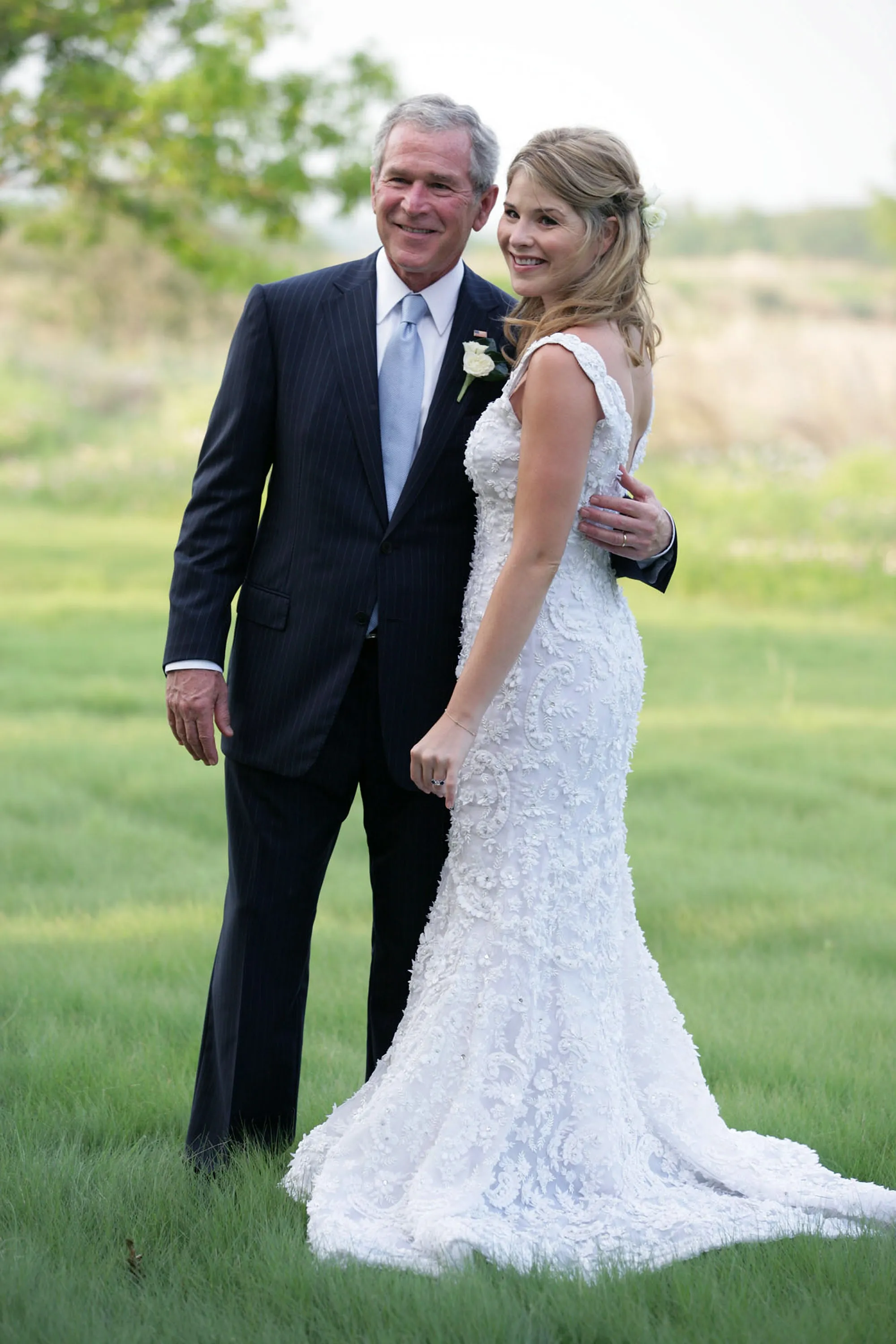George W. Bush posing with Jenna Bush at her wedding.