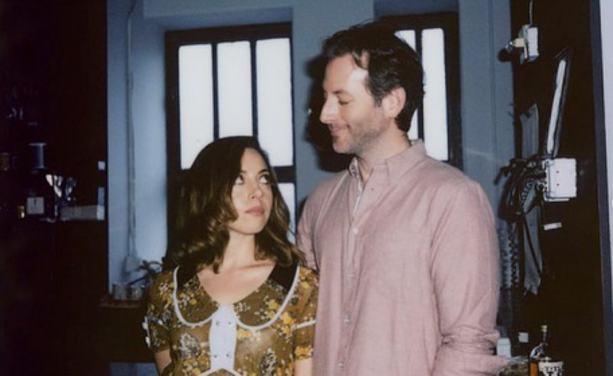 Aubrey Plaza looking up at Jeff Baena.