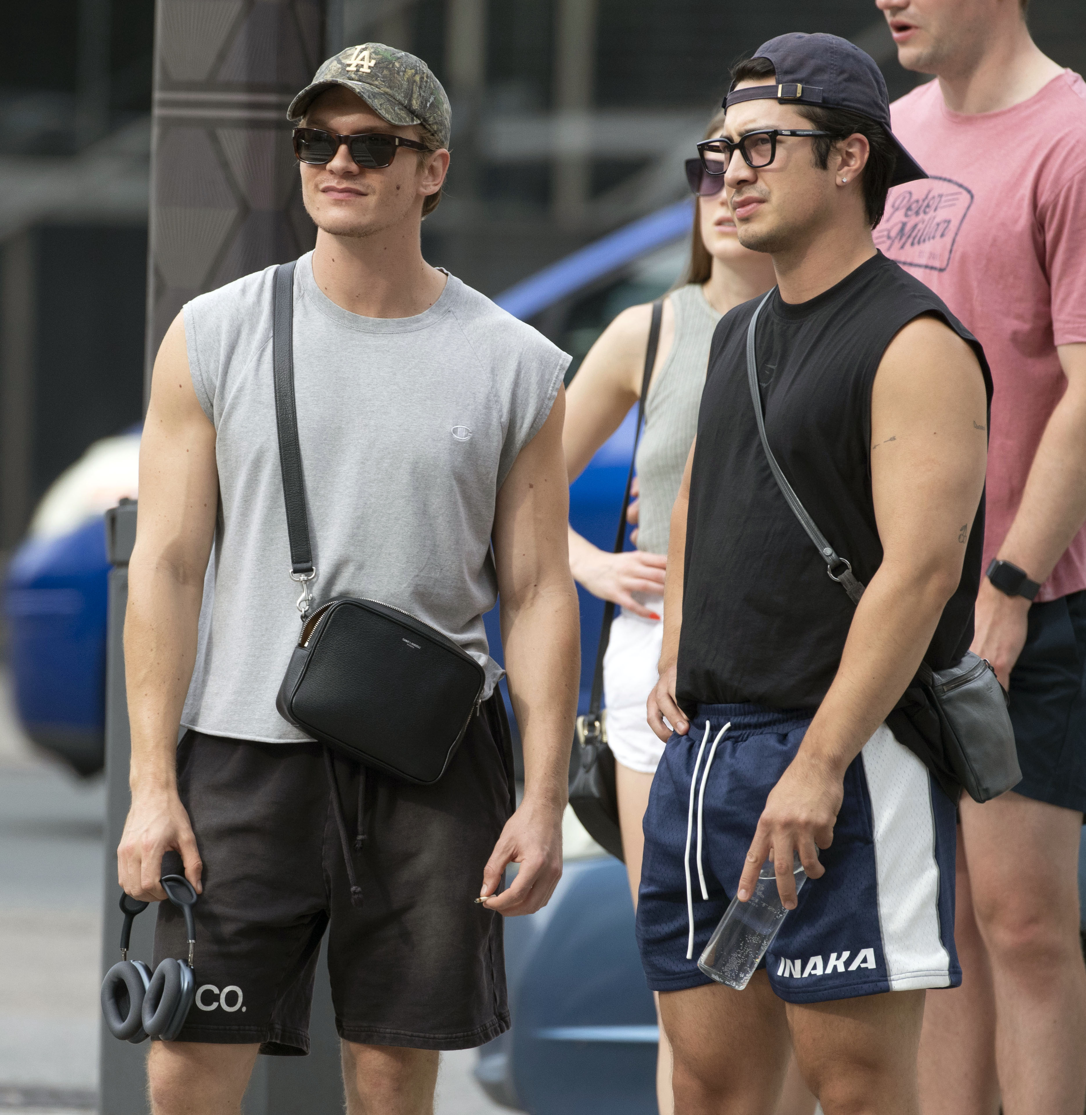 Hudson Williams wearing a Gymshark shirt, Inaka shorts, and Armani bag, and Connor Storrie wearing a grey shirt, YSL bag, Elend Co. shorts, and Autry sneakers, going to the gym.