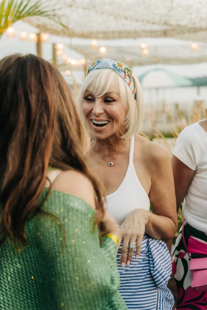 Jill Zarin smiling and talking to another woman at the Page Six's VRT Out East Party.