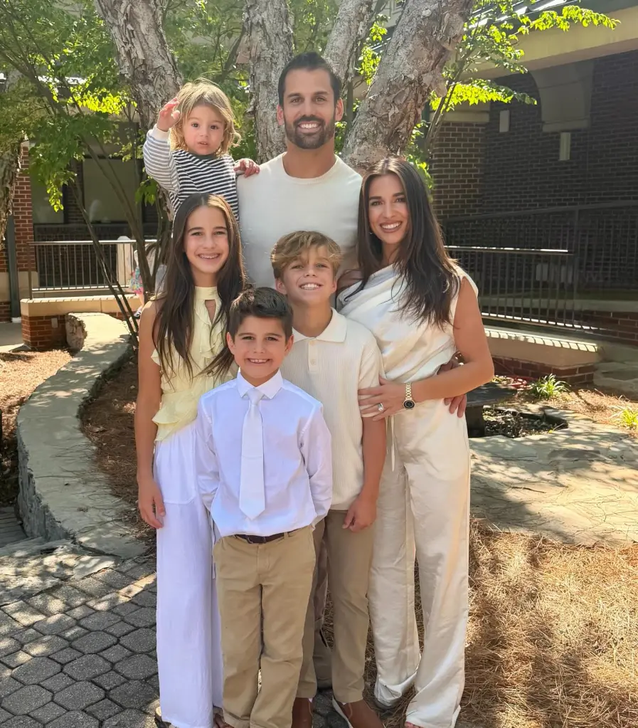 Jesse James and Eric Decker posing with their four children.