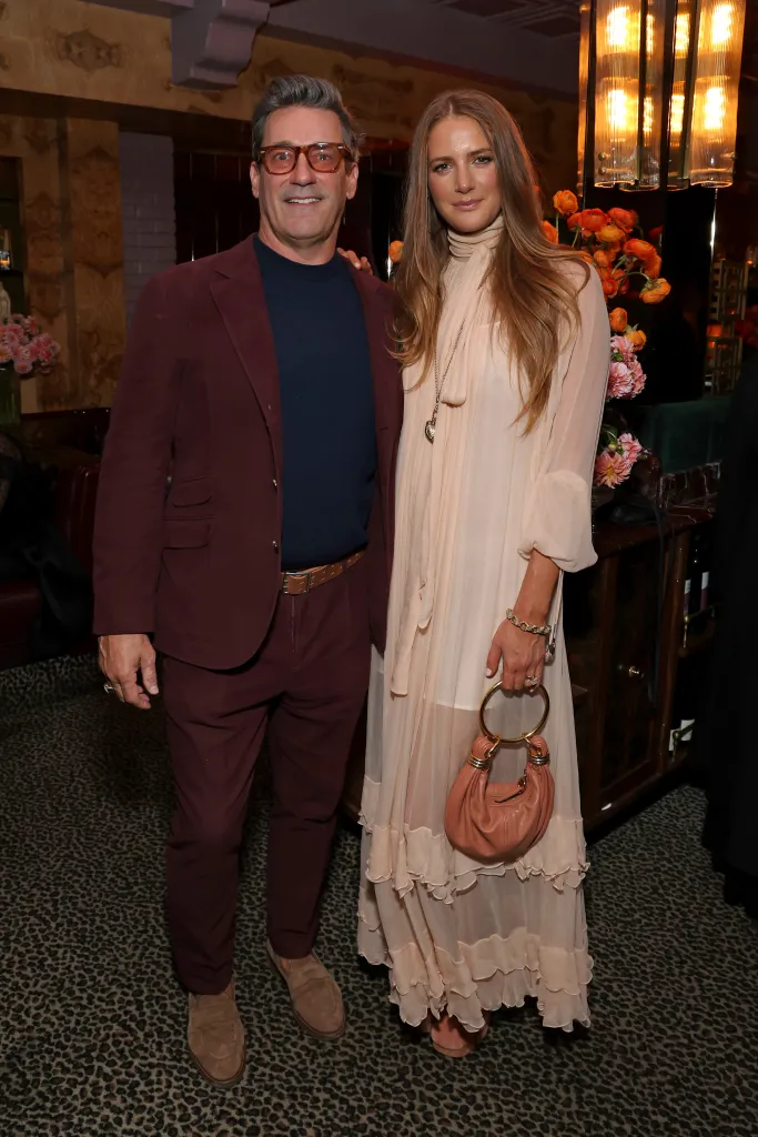 Jon Hamm and Anna Osceola posing at an intimate dinner hosted by W Magazine and Chloé.