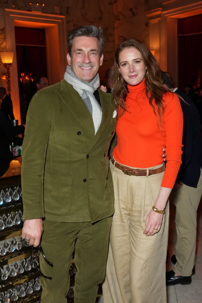 Jon Hamm and Anna Osceola smiling at "The Phoenician Scheme" New York premiere.