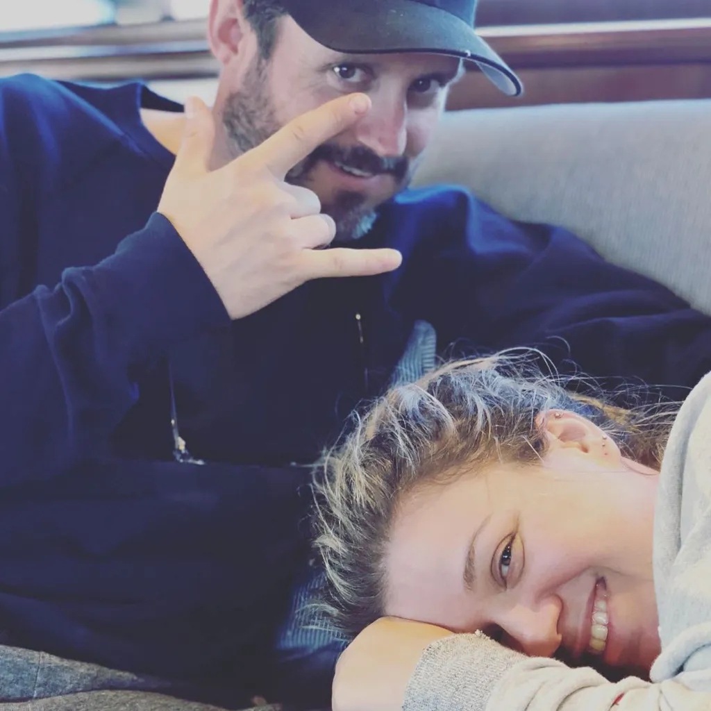 Kelly Clarkson and her ex-husband, Brandon Blackstock, relaxing together.
