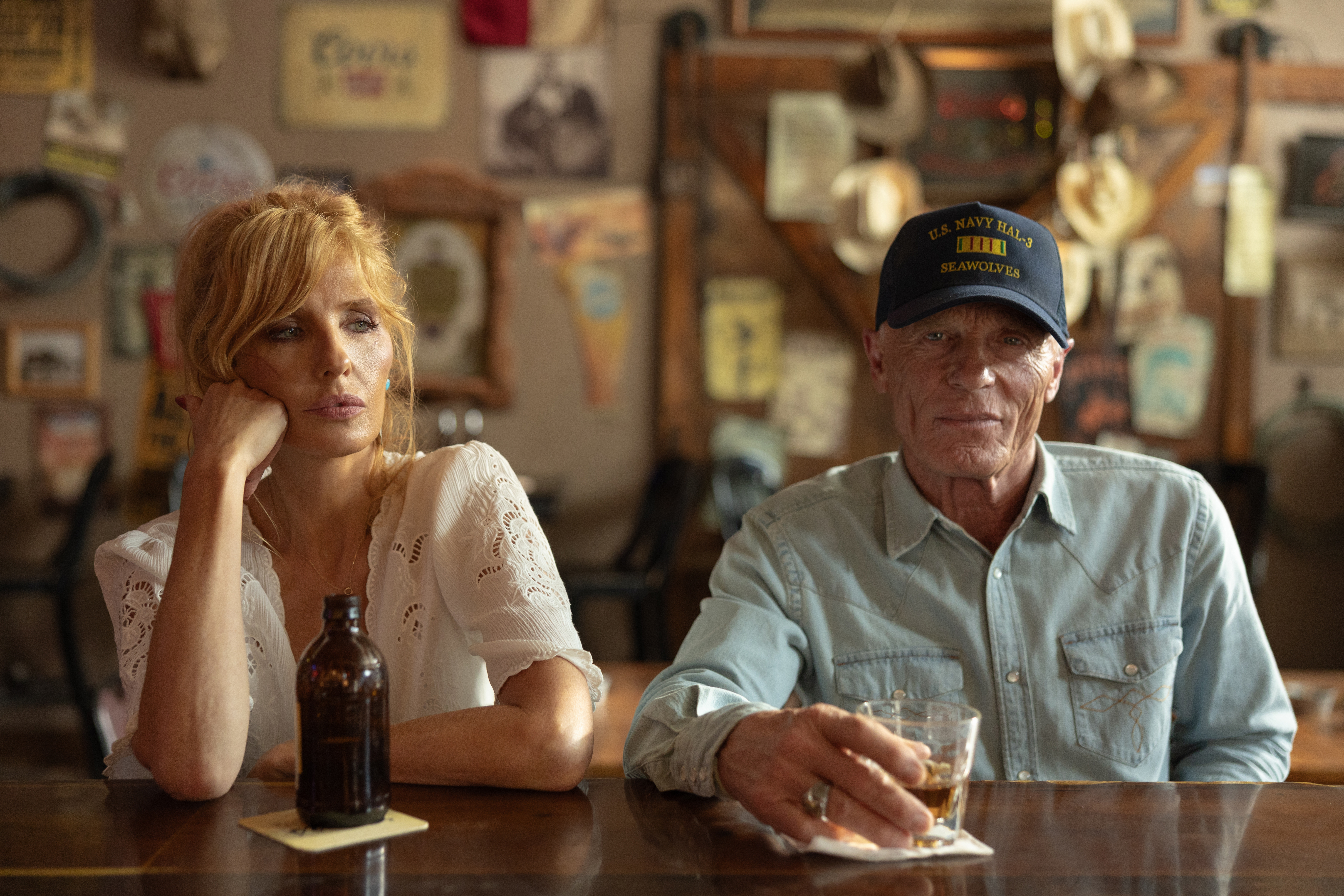 Beth Dutton and Everett McKinney sitting at a bar.
