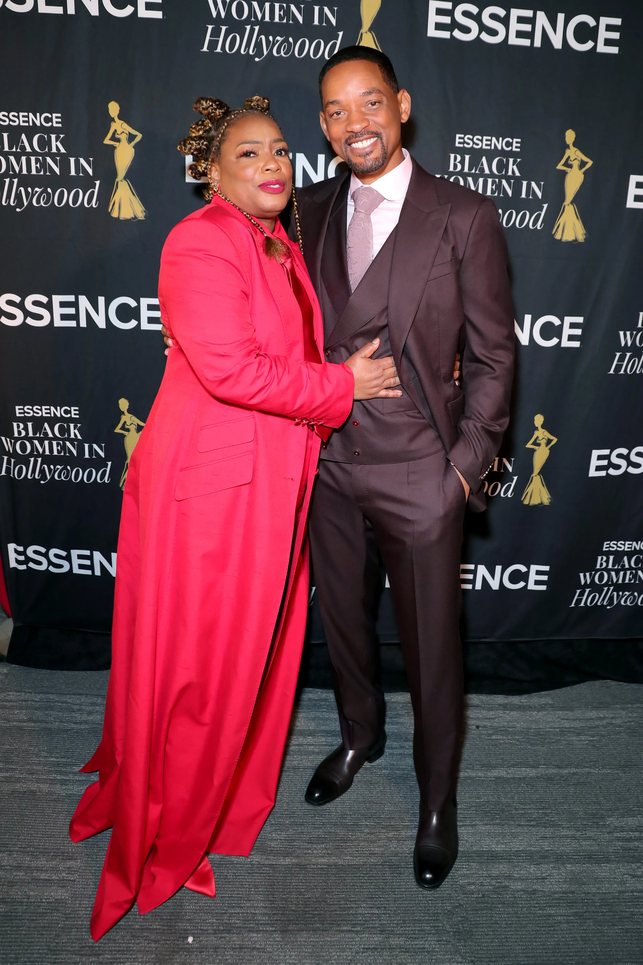 Aunjanue Ellis-Taylor embraces Will Smith at the Essence Black Women in Hollywood Awards Luncheon.