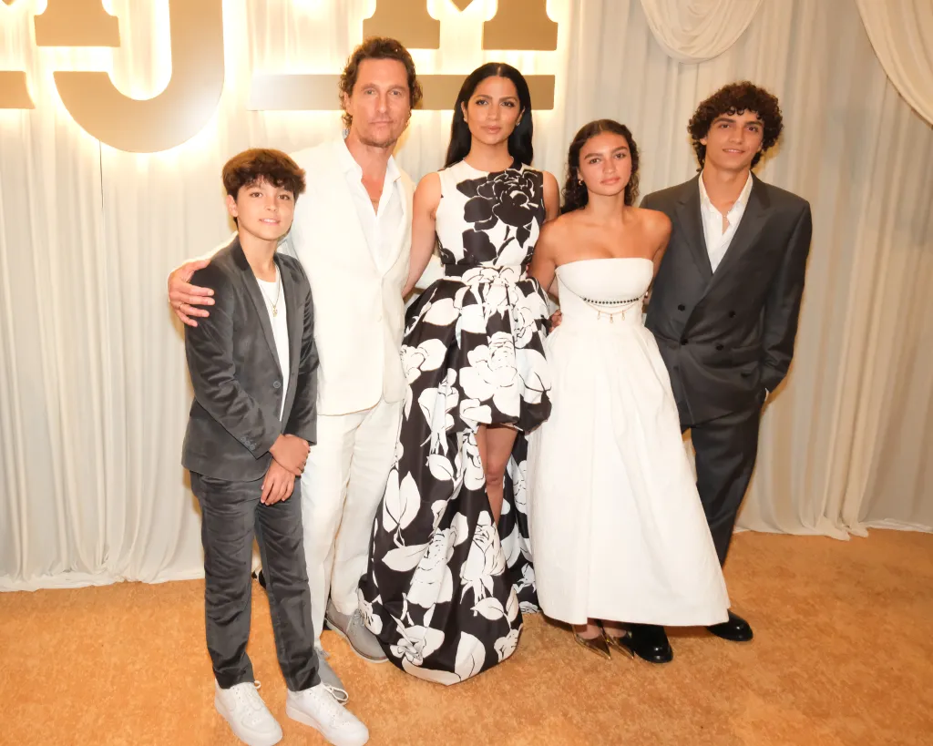 Matthew McConaughey, Camila Alves McConaughey, and their three children, Livingston, Vida, and Levi, pose together.