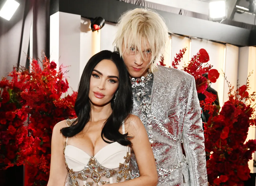Megan Fox and Machine Gun Kelly pose together at the 65th GRAMMY Awards.