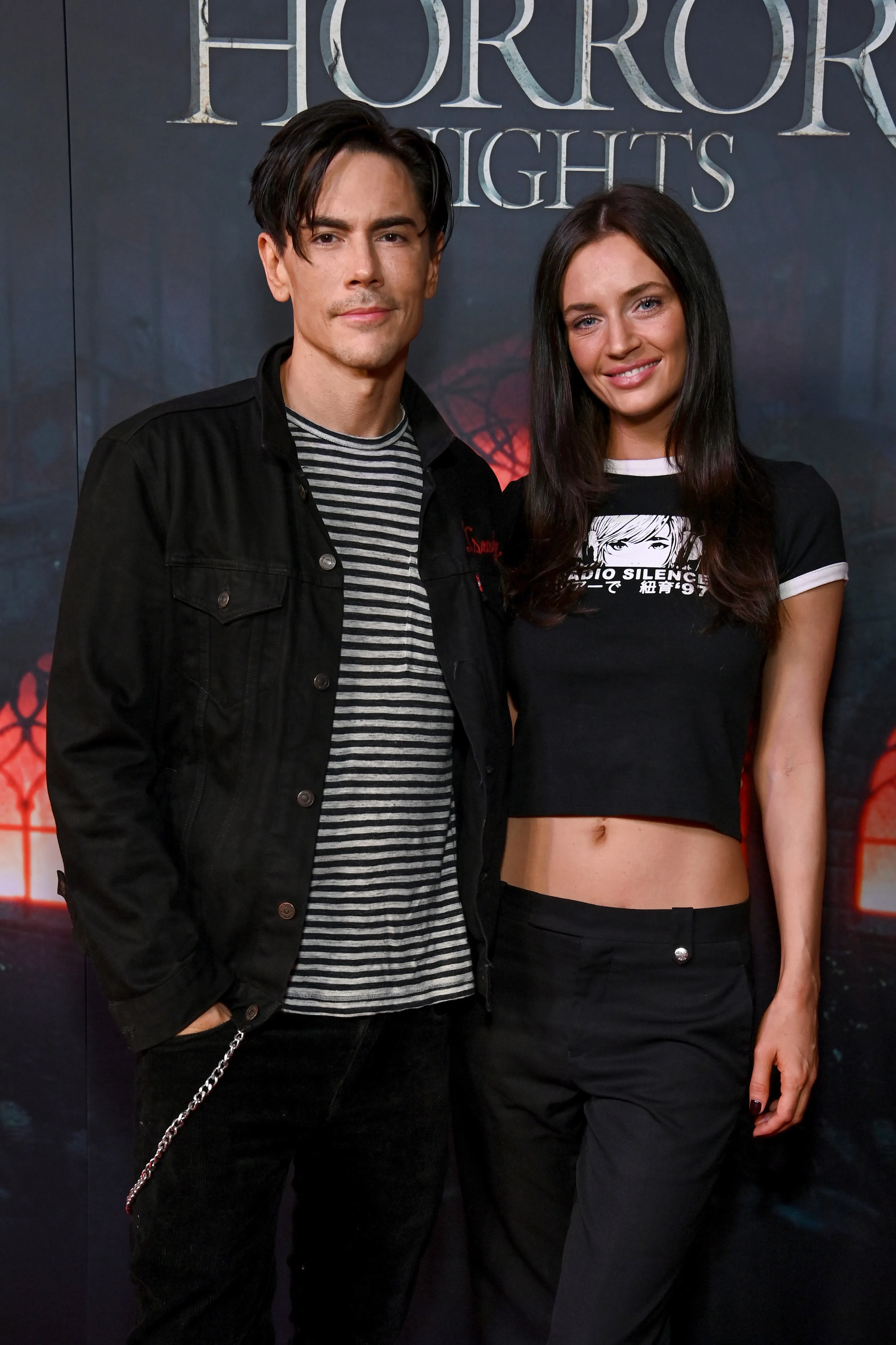 Tom Sandoval and Victoria Lee Robinson posing at Halloween Horror Nights Opening Night.