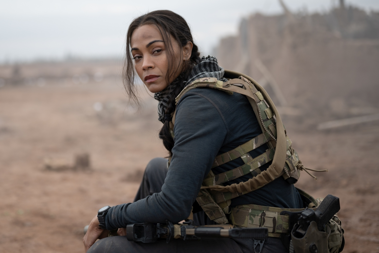 Zoe Saldaña says Taylor Sheridan gives actors two choices on his sets: accept the challenge or quit. The "Lioness" star reveals his approach.