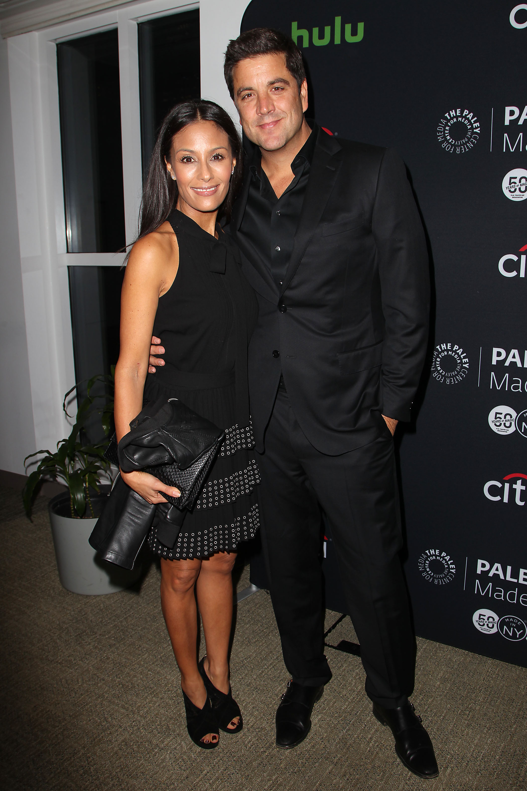 Josh Elliott and Liz Cho posing together at an event.