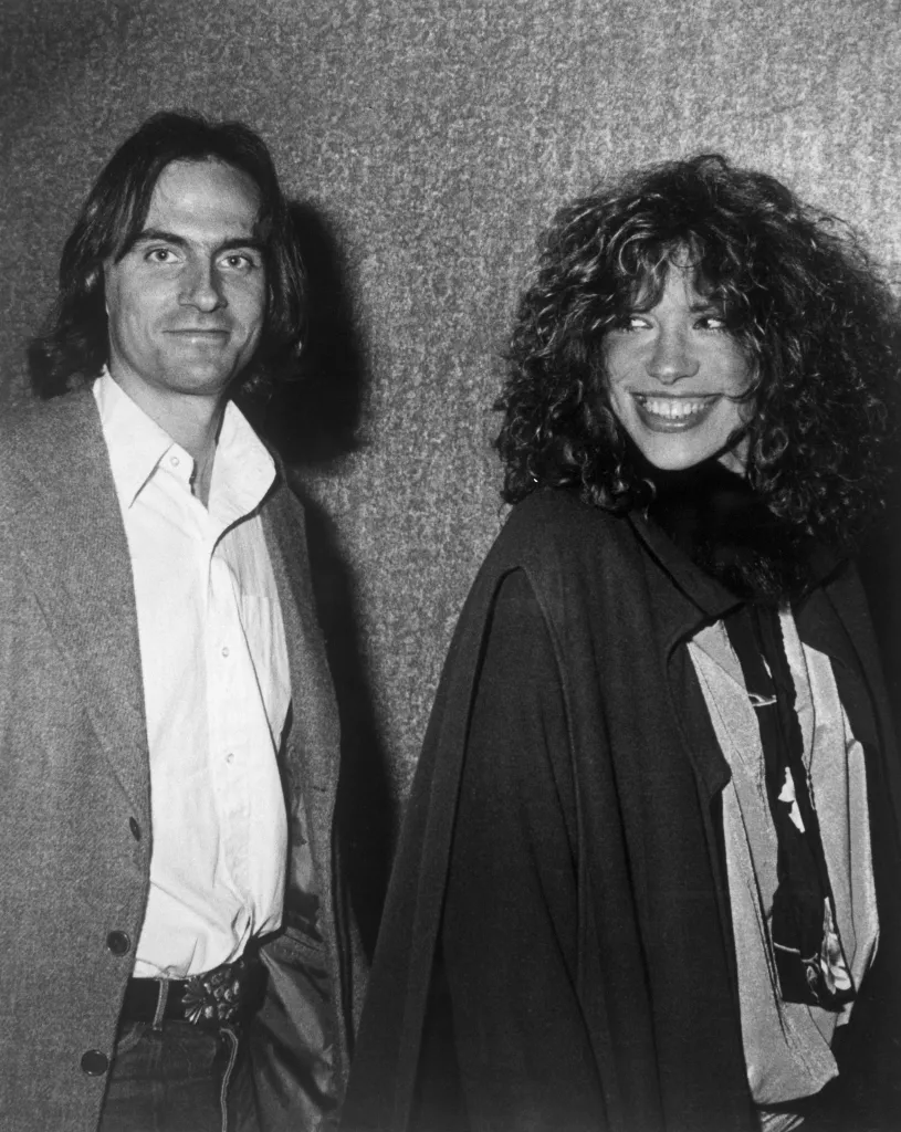 Half-length black and white portrait of James Taylor and Carly Simon.