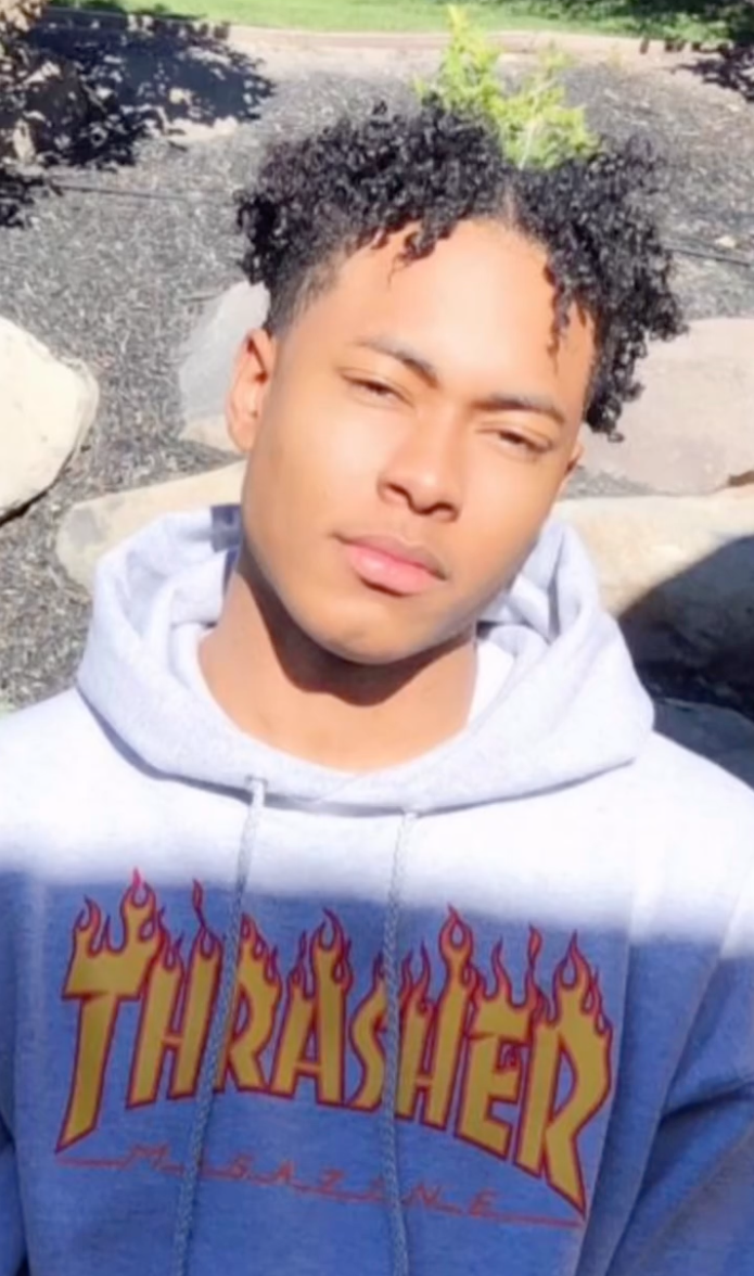 Mary Cosby's son, Robert Jr., in a grey hoodie with the 