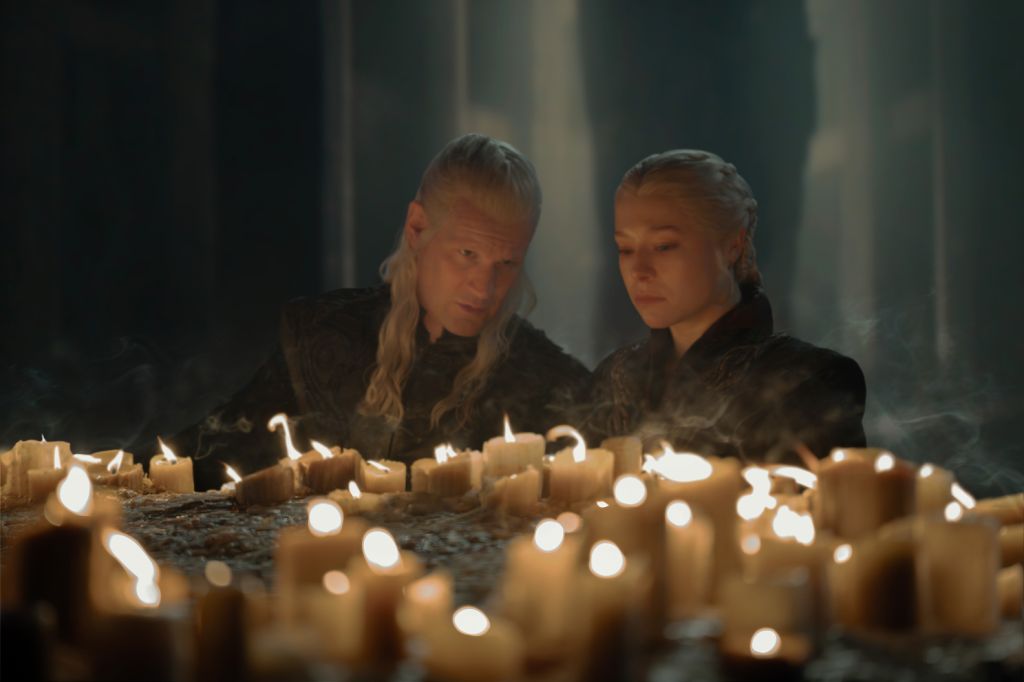 Matt Smith and Emma D'Arcy looking at candles in House of the Dragon.