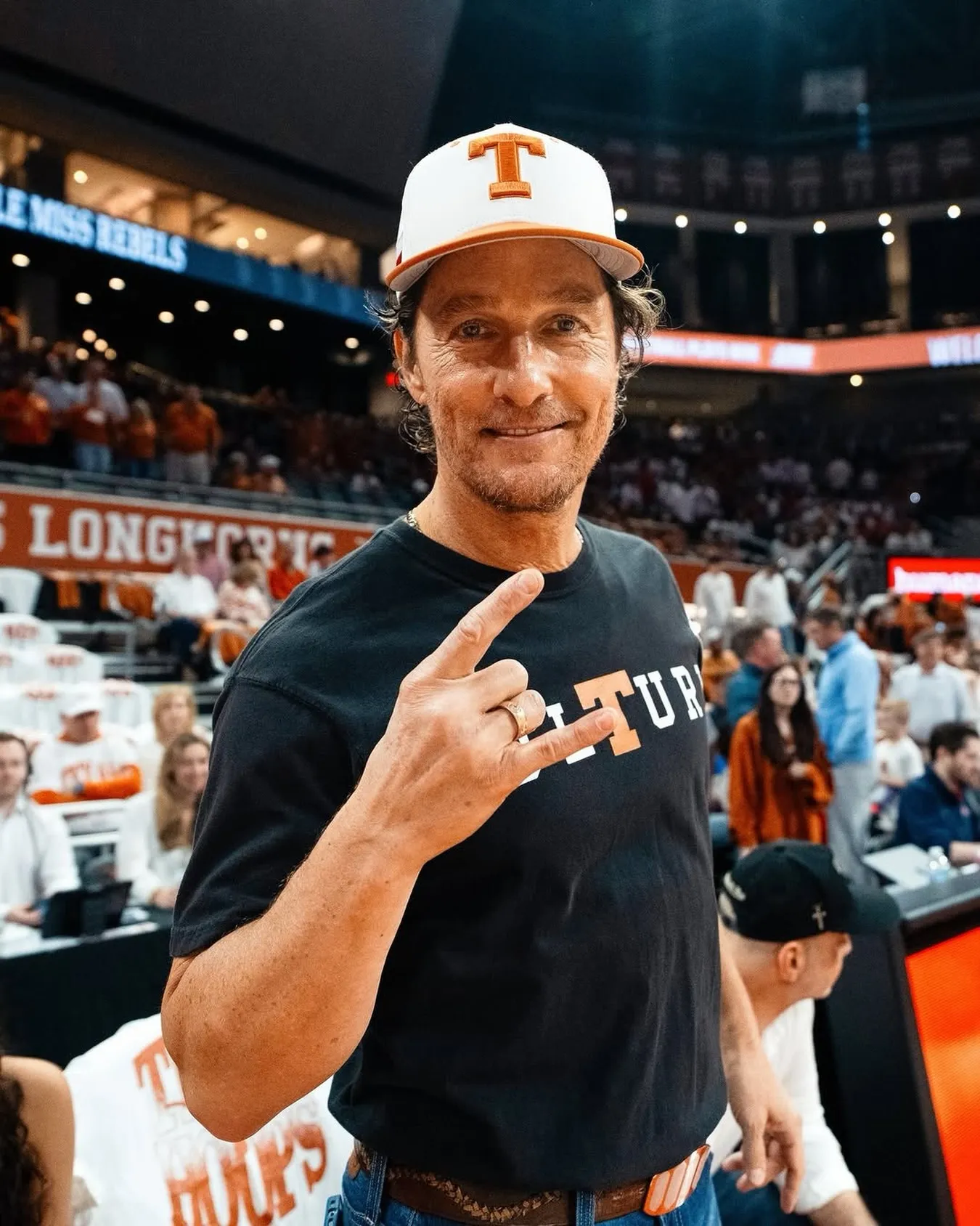 Matthew McConaughey in a baseball cap with a 