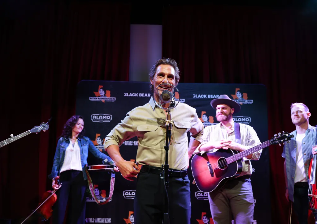Matthew McConaughey onstage performing at the dedication ceremony for the Matthew McConaughey Cinema.
