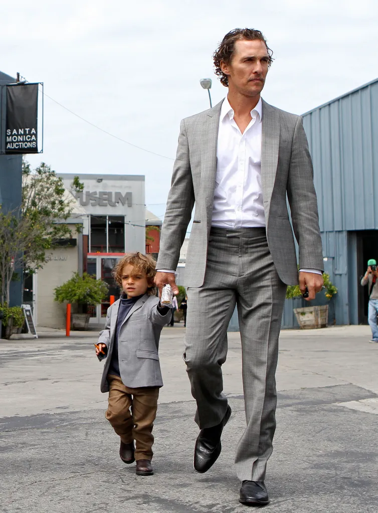 Matthew McConaughey and his son, Levi Alves McConaughey, walk hand-in-hand.