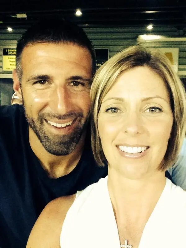 Mike Vrabel and wife Jen smiling for a selfie.