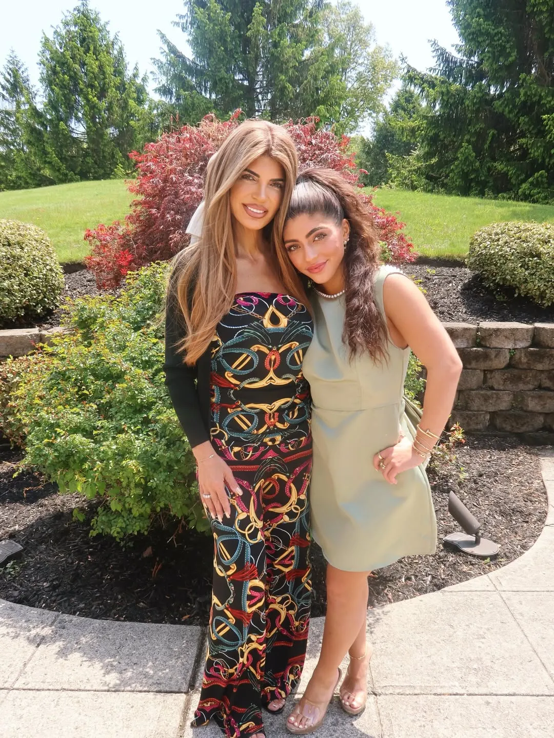 Milania Giudice and Teresa Giudice posing together outdoors.