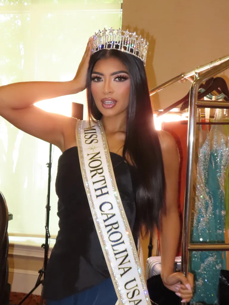 Brittany Boltinhouse wearing a crown and "MISS NORTH CAROLINA USA" sash.