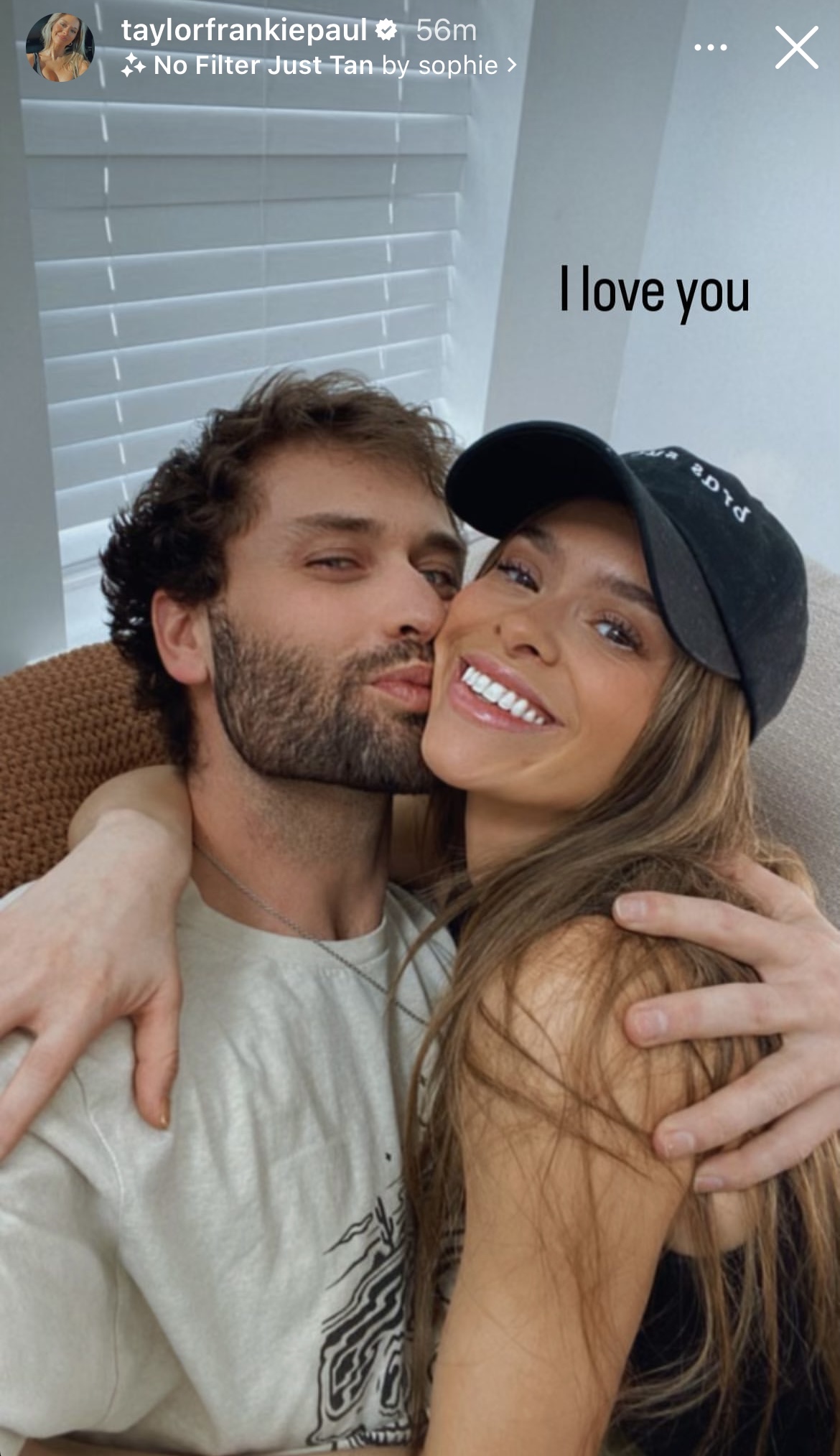 Paul and Mortensen embracing with "I love you" written on the image.