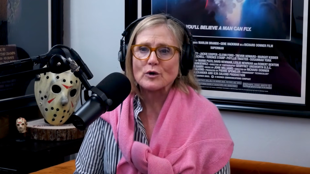Nancy Cartwright speaking into a microphone.