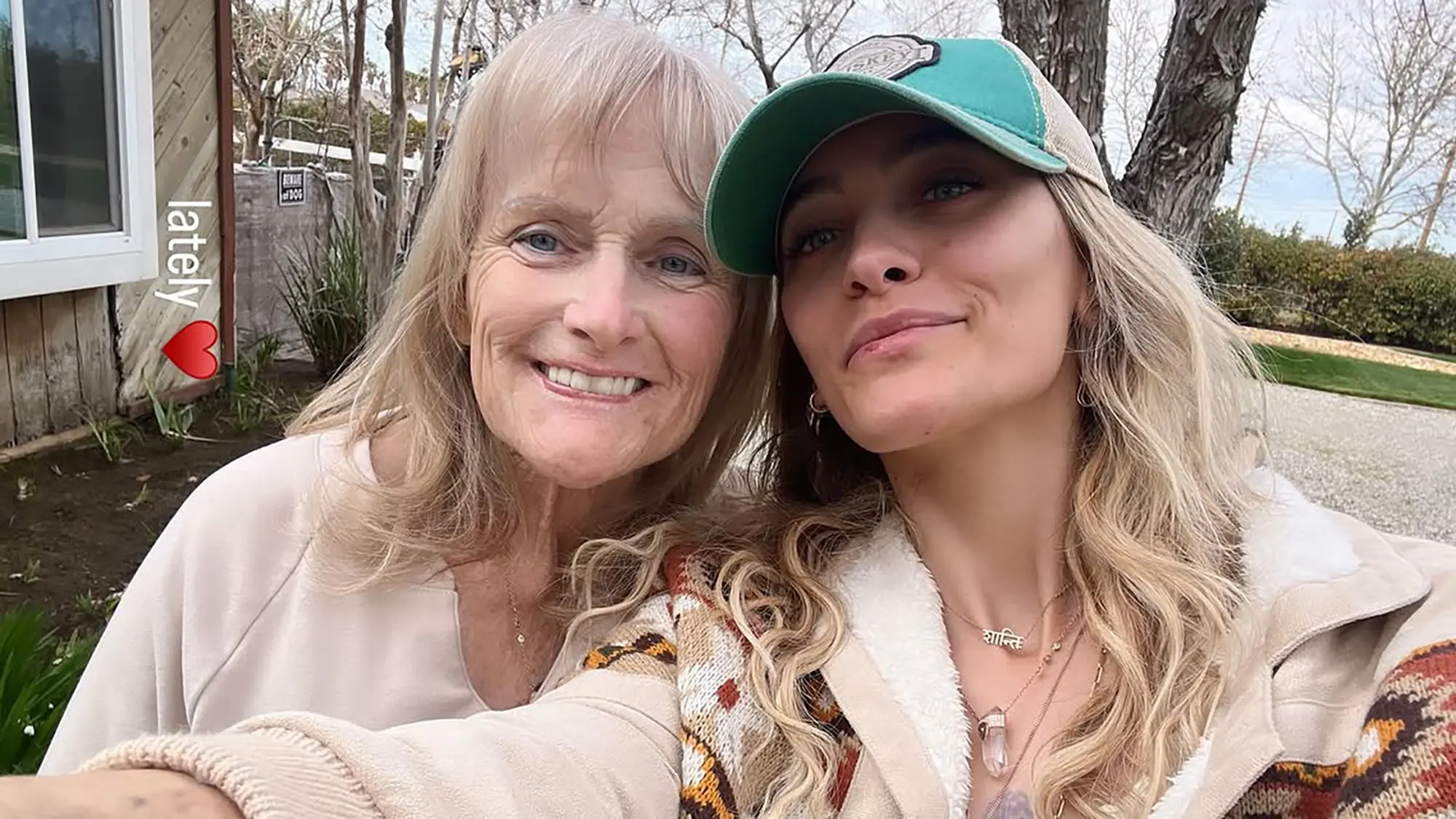 Paris Jackson and her mother Debbie Rowe posing together for a selfie.