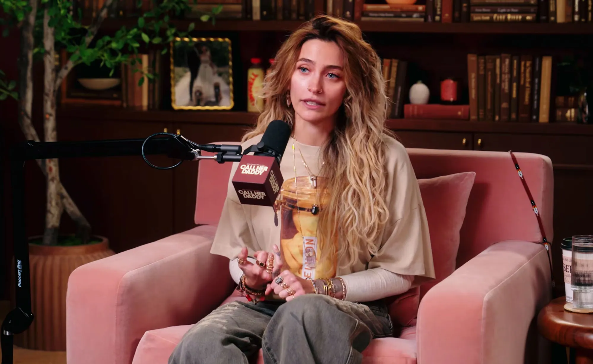 Paris Jackson speaking into a "Call Her Daddy" podcast microphone.