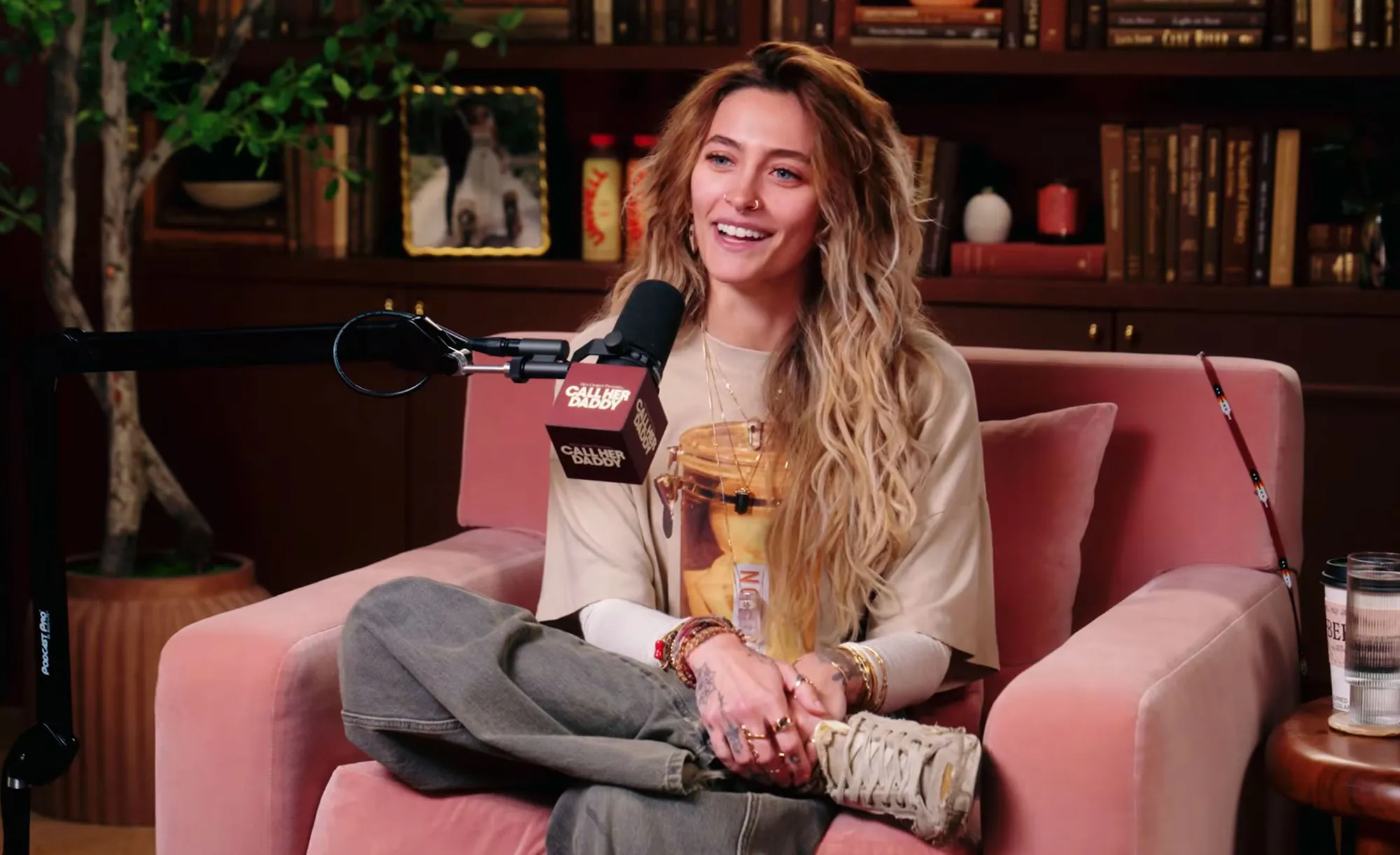 Paris Jackson speaking into a Call Her Daddy podcast microphone.