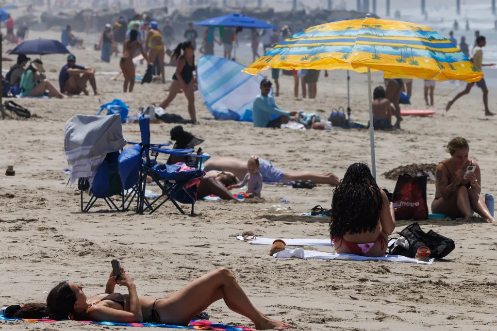 People on Venice Beach escape the LA heat.