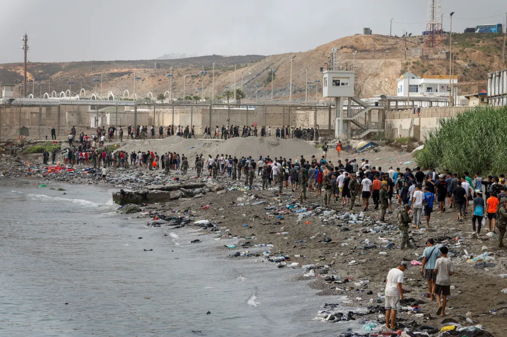 Migrants cross into the Spanish enclave of Ceuta from Morocco.