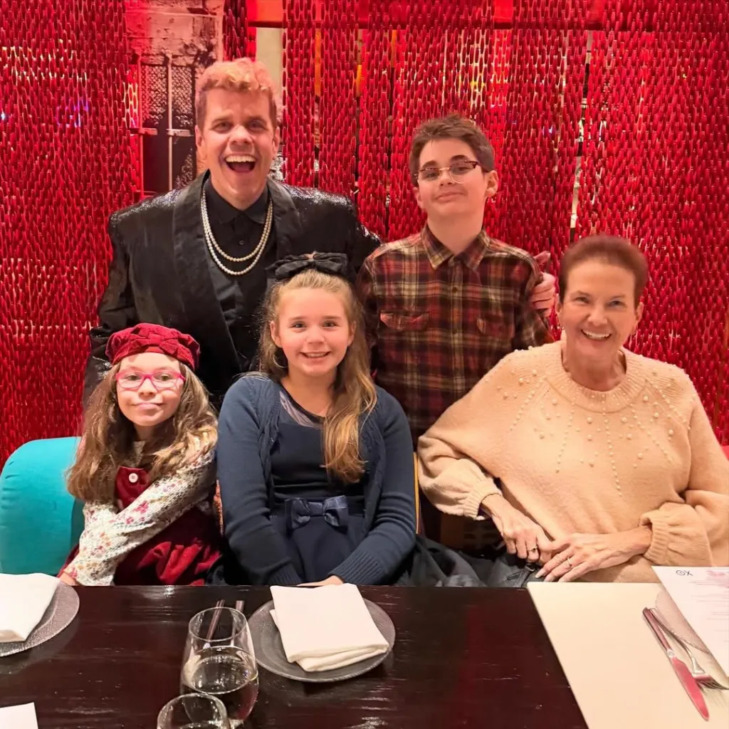Perez Hilton poses with his mom and kids.