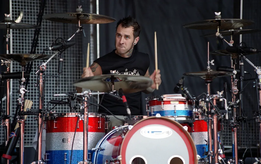 Travis Barker of Blink 182 performing on drums.