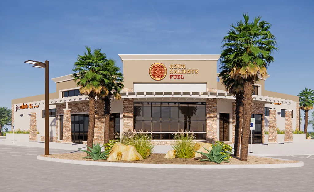 Illustration of the newly opened Agua Caliente Fuel station, a tan building with stone accents, palm trees, and desert landscaping.