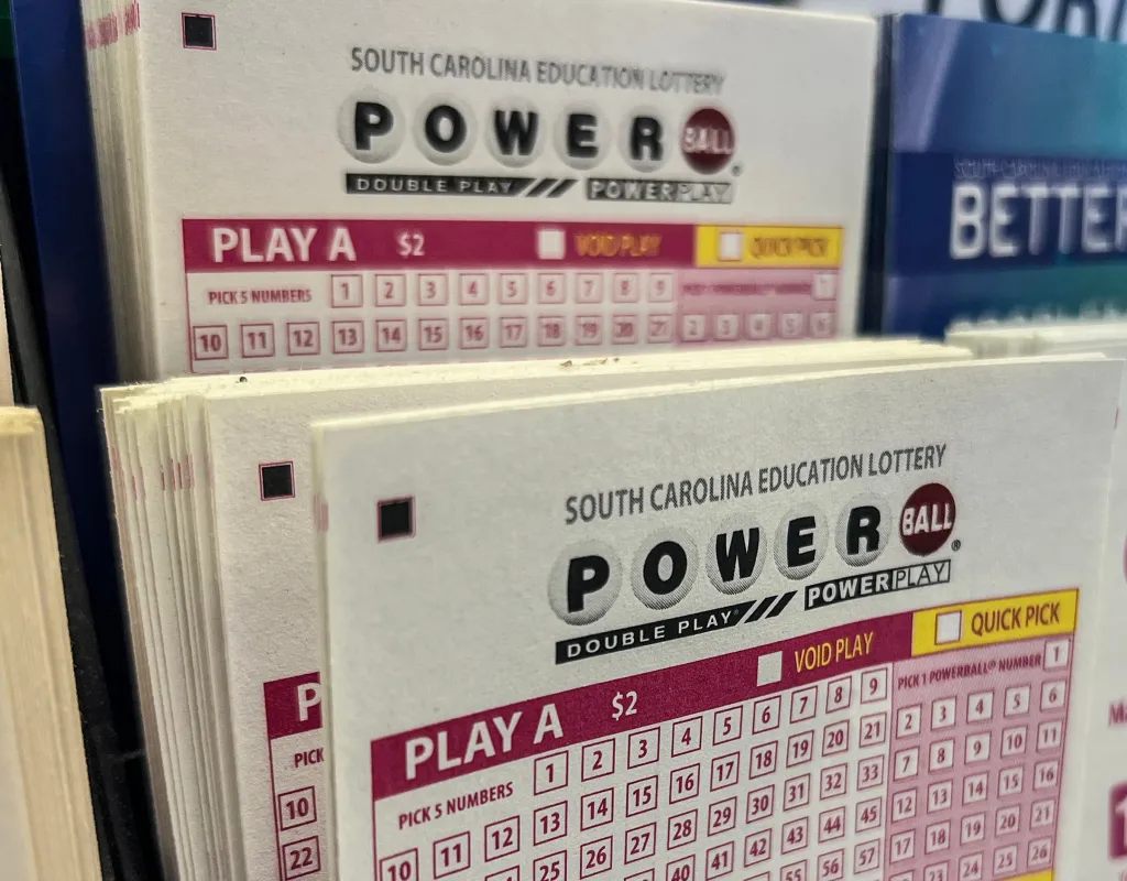 South Carolina Education Lottery Powerball tickets displayed in a holder.