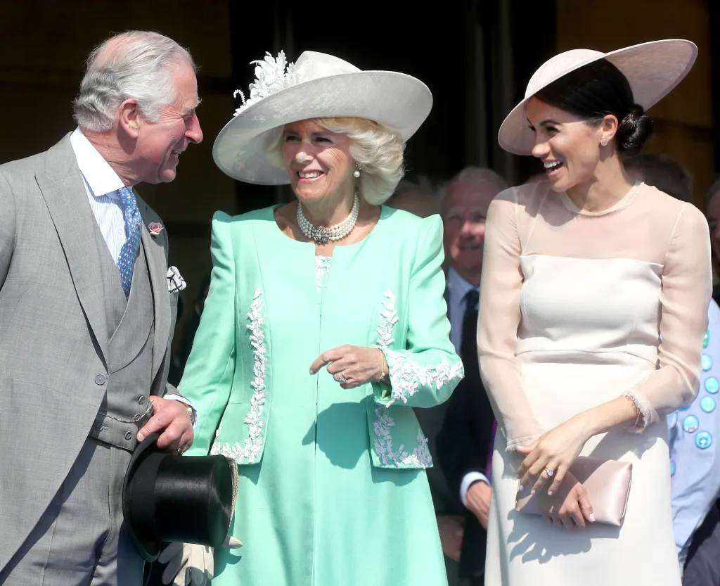 Prince Charles, Camilla, and Meghan Markle at a Buckingham Palace event.