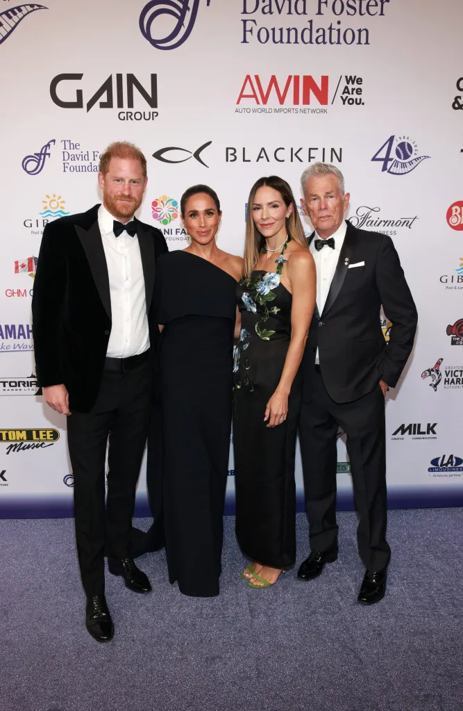 Prince Harry, Meghan Markle, Katharine McPhee, and David Foster pose at the David Foster Foundation 40th Anniversary Celebration.