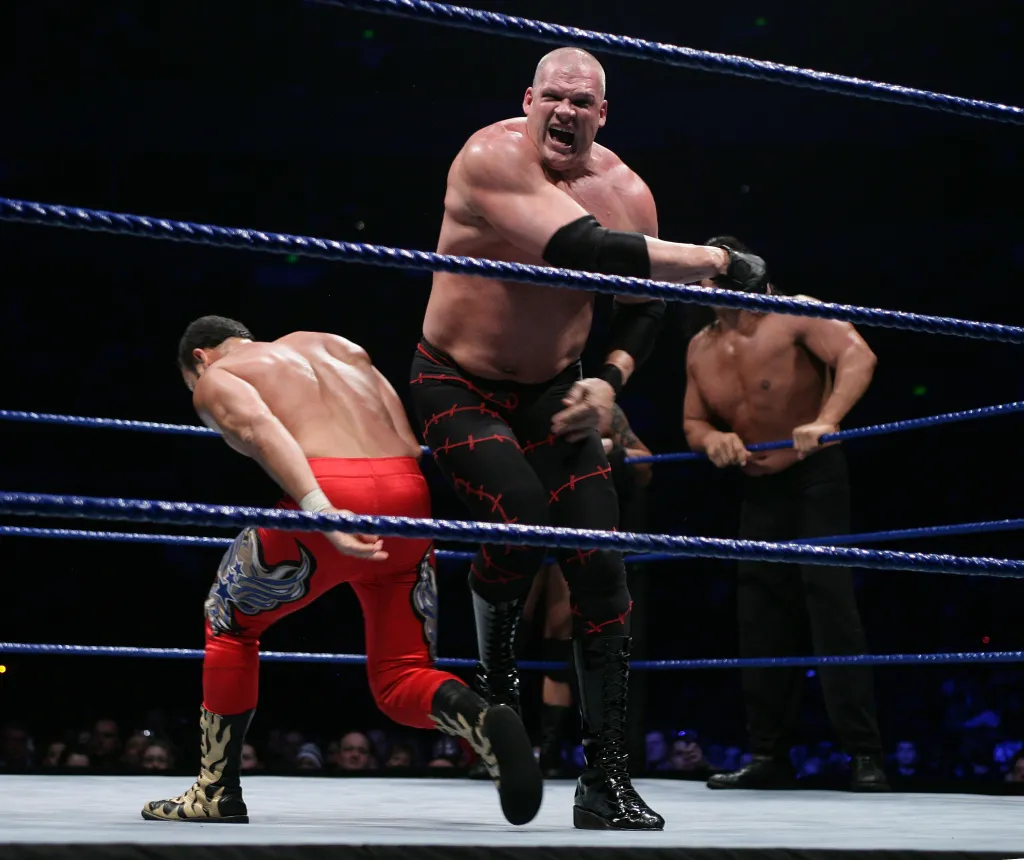 Kane (R) taking on Chavo Guerrero, Jr. during WWE Smackdown.