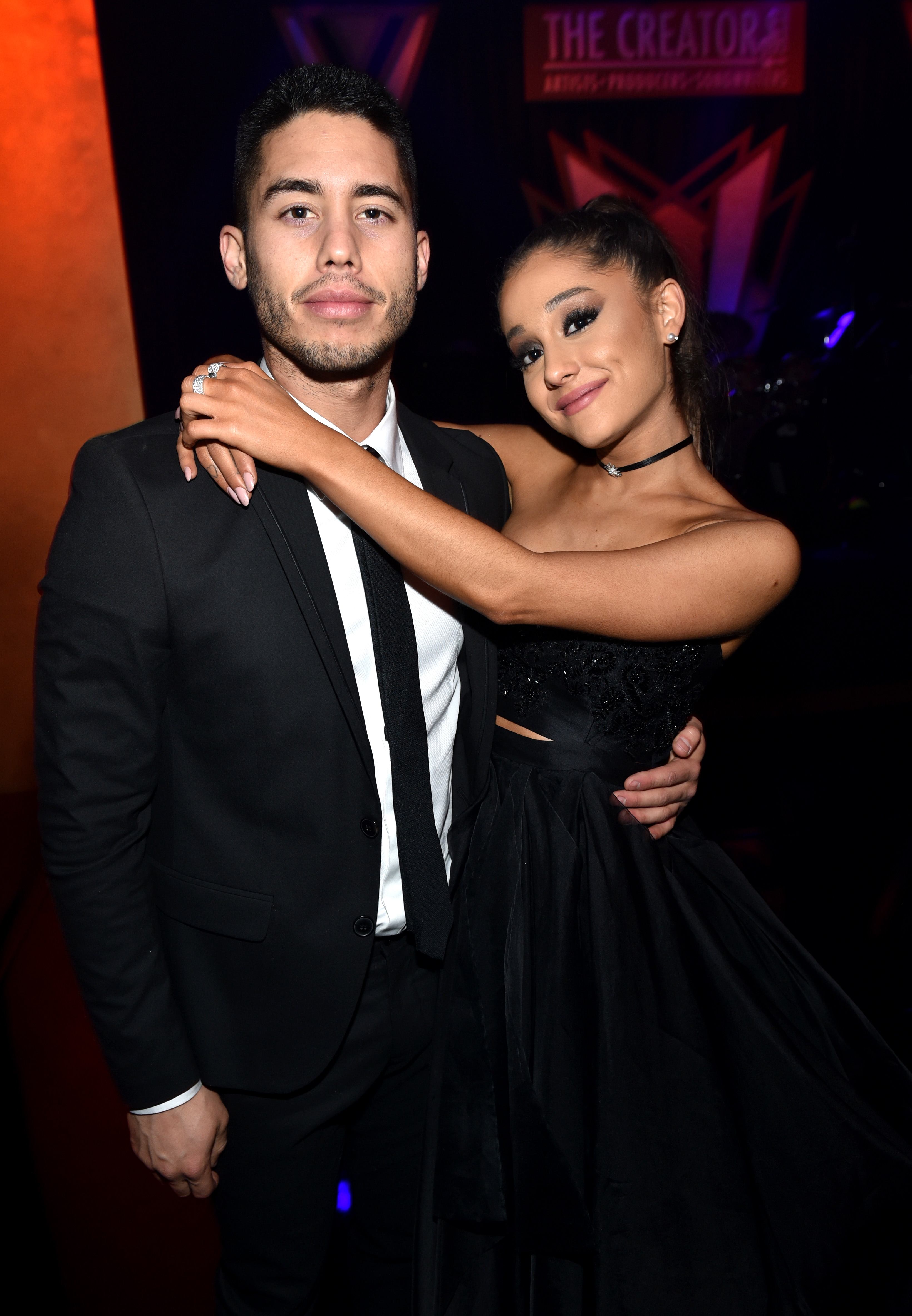Ricky Alvarez and Ariana Grande posing together.
