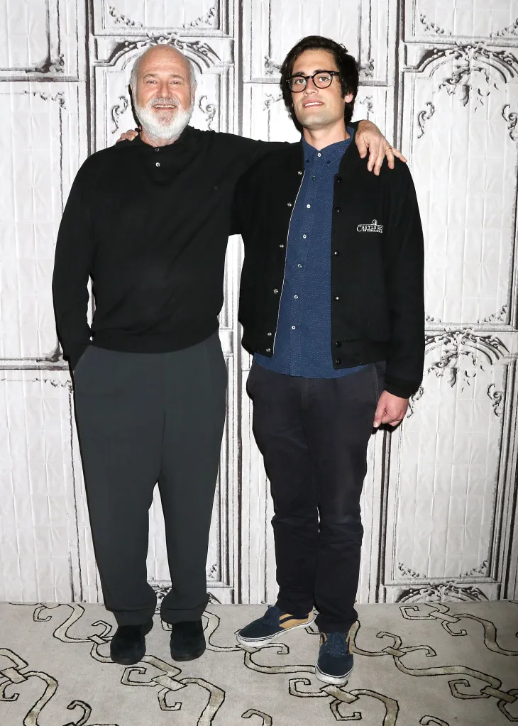 Rob Reiner and Nick Reiner standing together, with Rob's arm around Nick's shoulder.