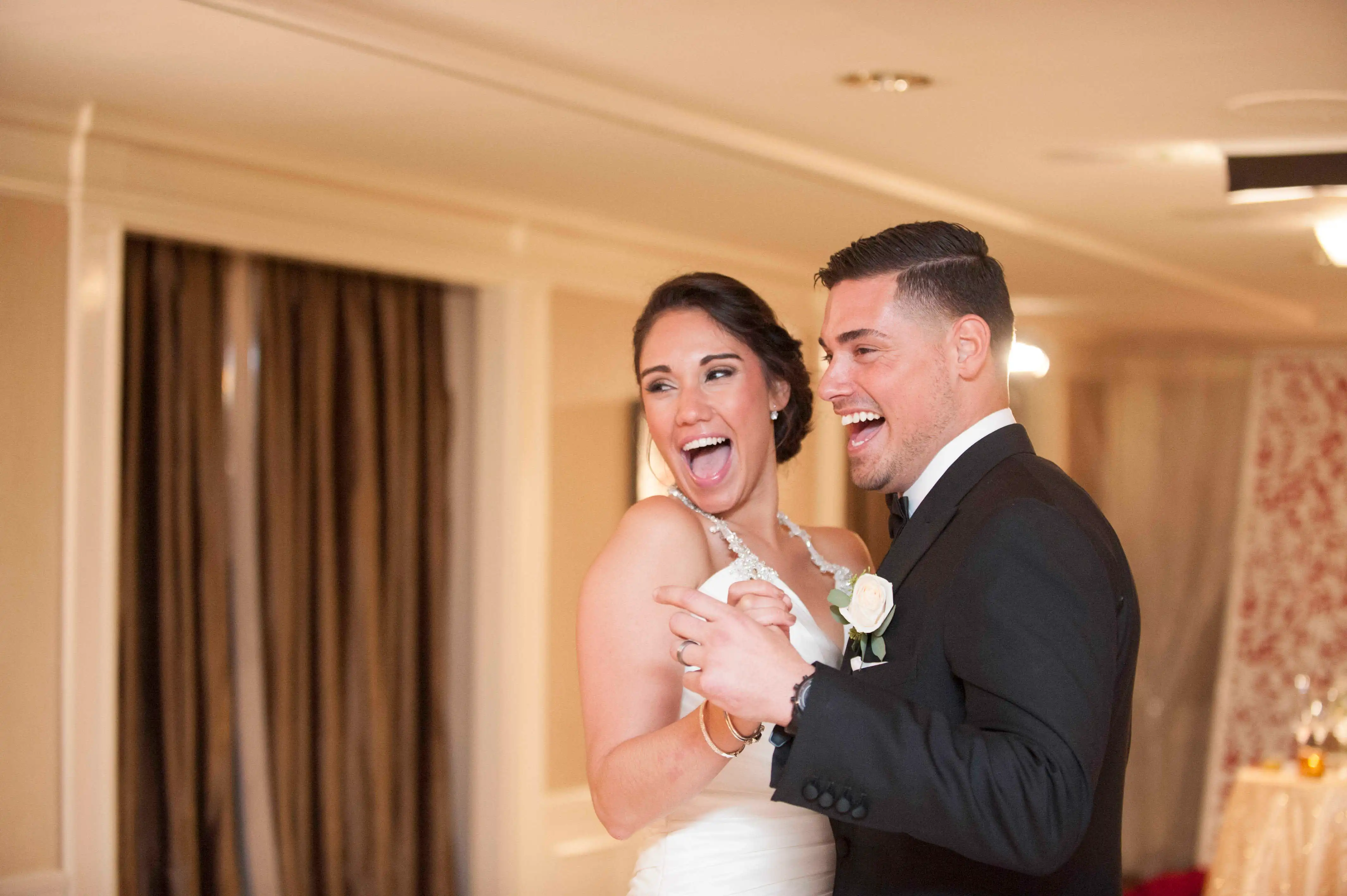 Ryan De Nino and Jessica Castro dancing at their wedding.